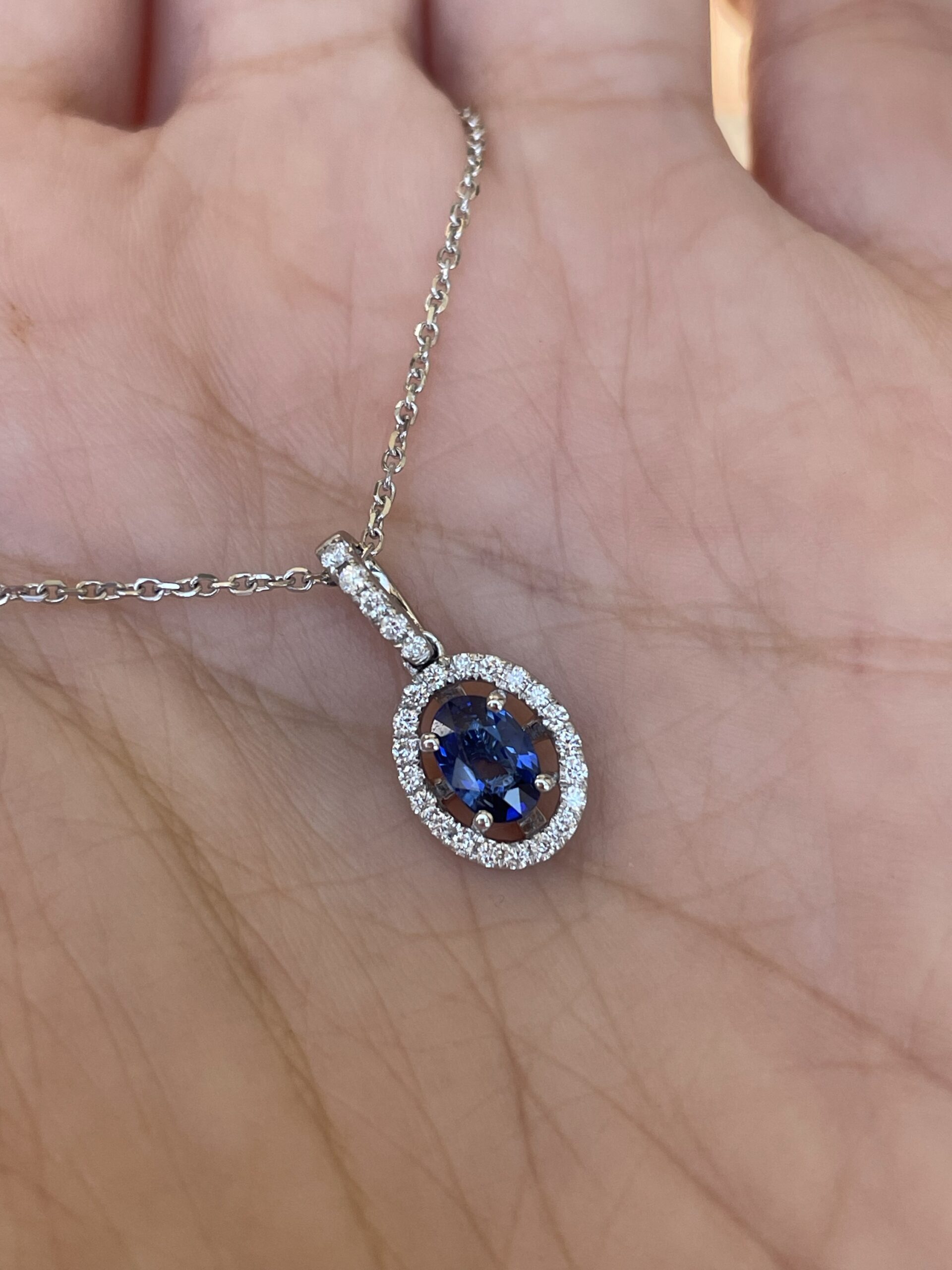 14k White Gold .51 Cttw Oval Shaped Genuine Sapphire & .17 Cttw Round Brilliant Cut Diamond Halo Pendant