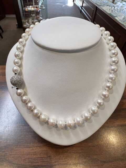 A Strand Of 8 MM Cultured Pearls With Diamond Clasp