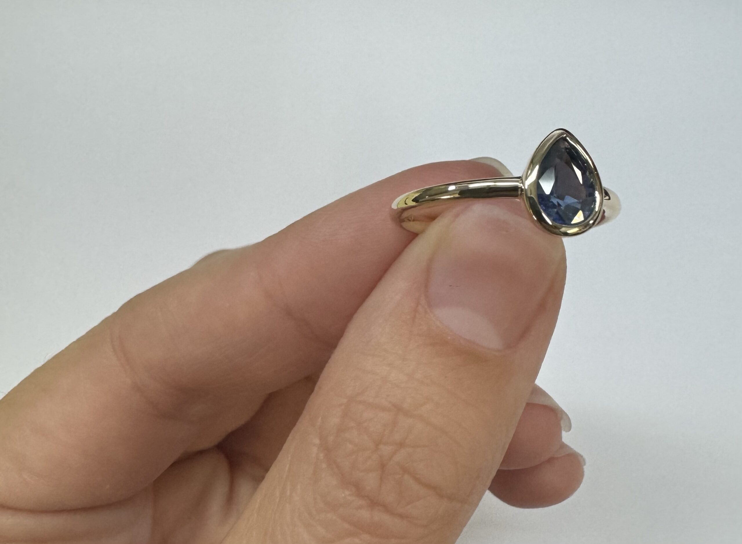 14k Yellow Gold .73 Cttw Pear Shaped Ceylon Sapphire Bezel Set Ring - Image 4