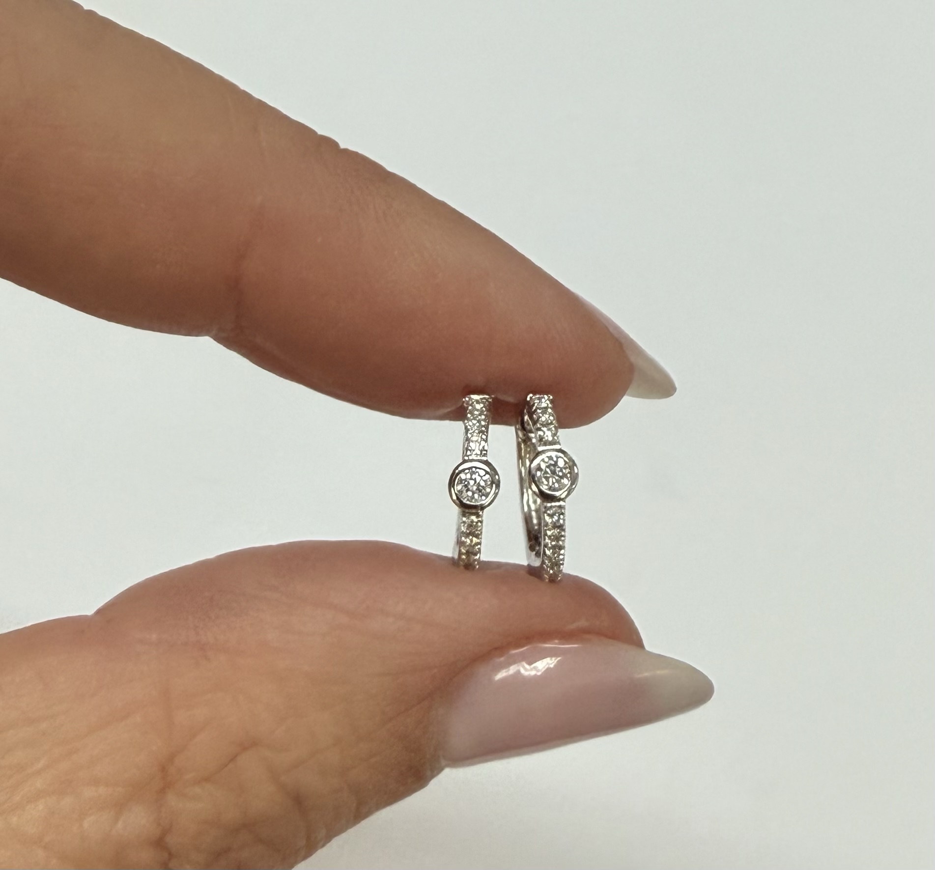 14k White Gold Bezel Set Genuine Diamond .12 Cttw Huggy Hoop Earrings