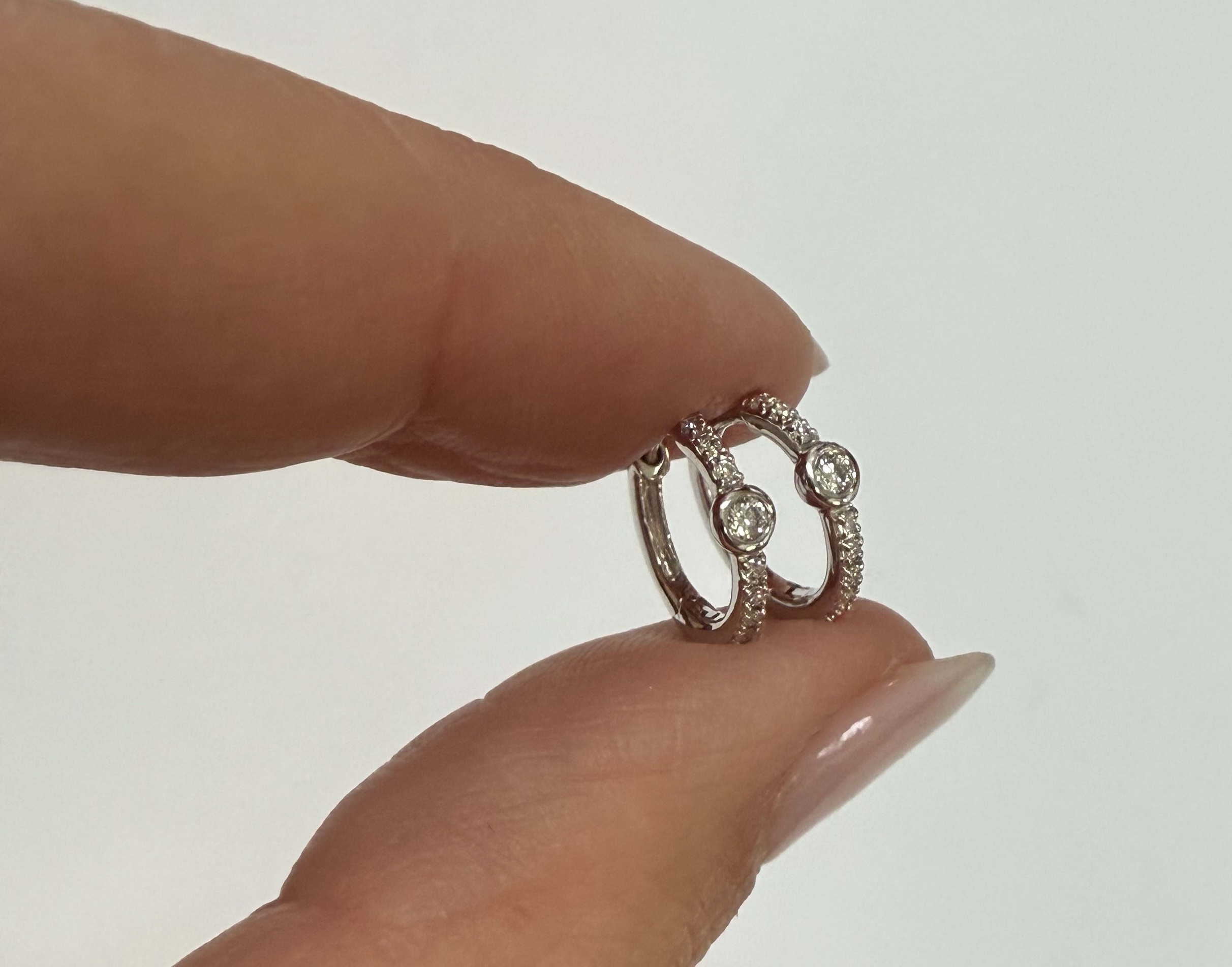 14k White Gold Bezel Set Genuine Diamond .12 Cttw Huggy Hoop Earrings - Image 4