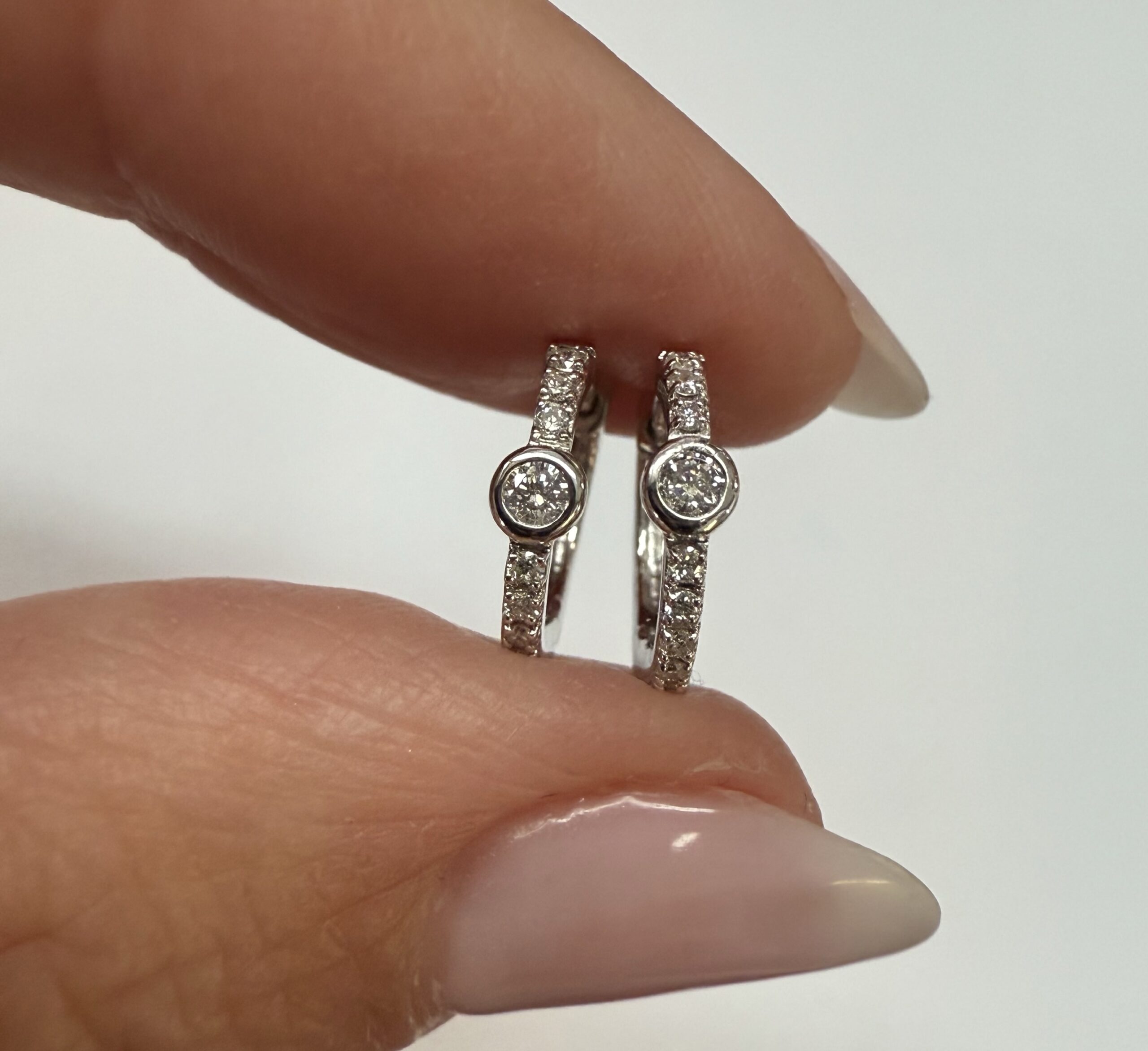 14k White Gold Bezel Set Genuine Diamond .12 Cttw Huggy Hoop Earrings - Image 8