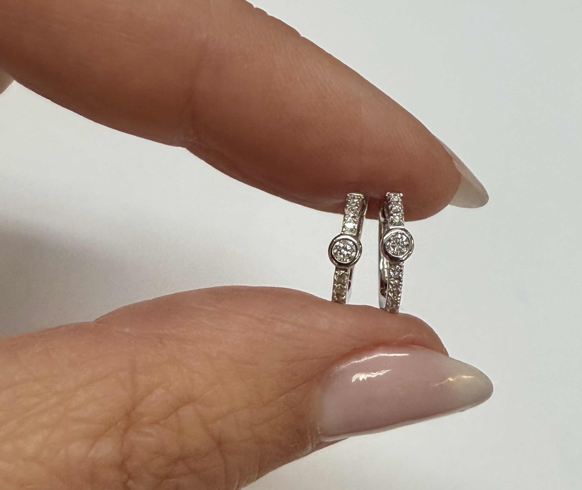 14k White Gold Bezel Set Genuine Diamond .12 Cttw Huggy Hoop Earrings - Image 9