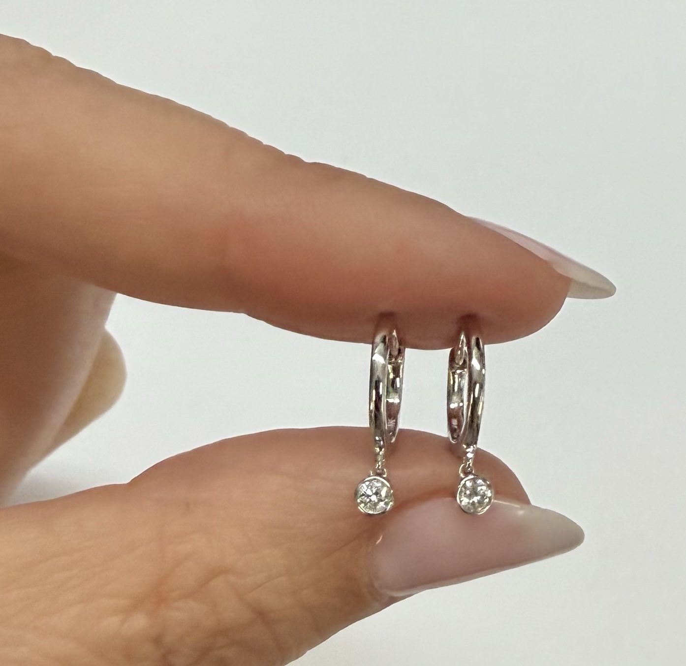 14k White Gold Genuine .08 Cttw Diamond Bezel Dangle Huggy Hoop Earrings - Image 14