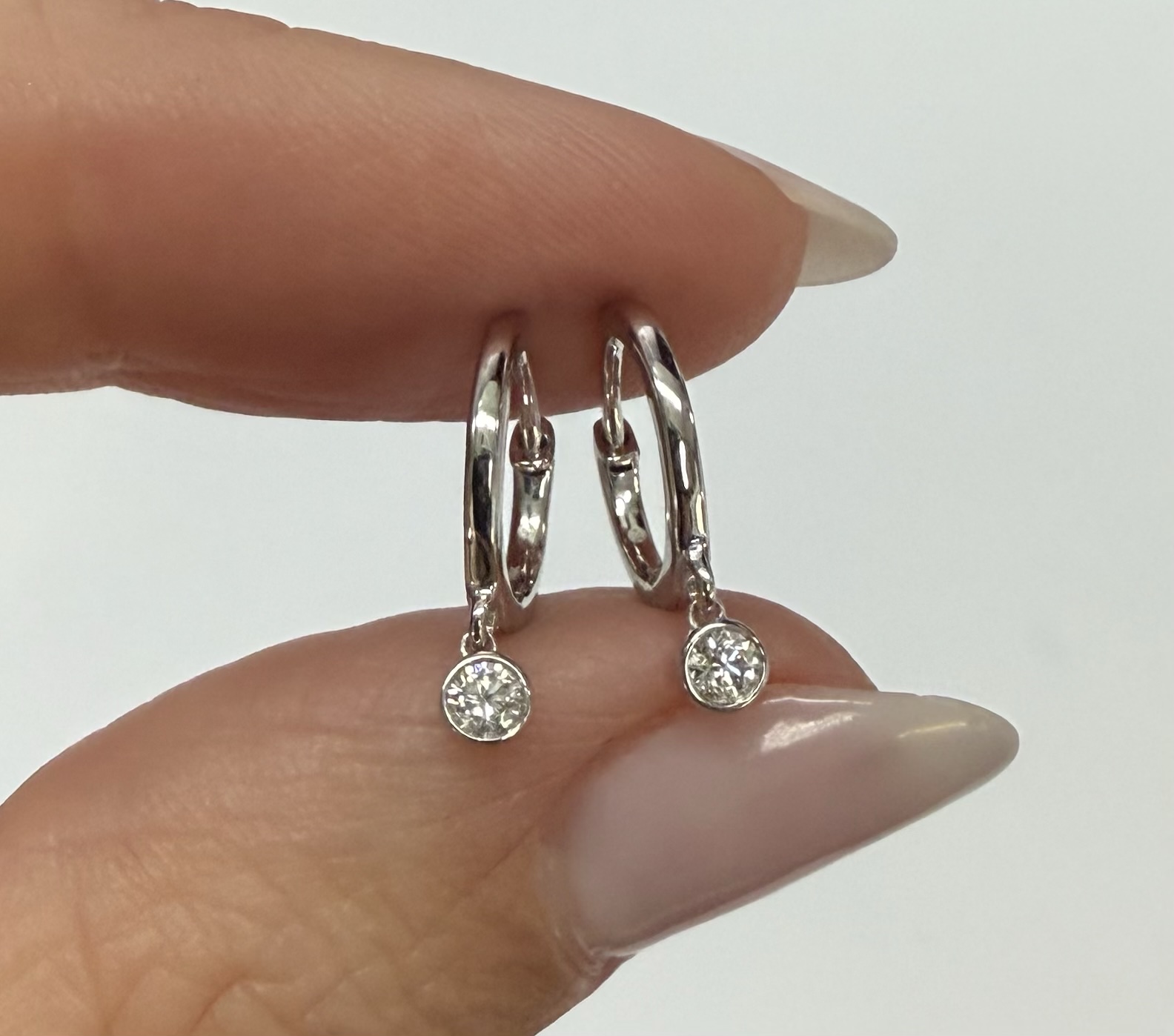 14k White Gold Genuine .08 Cttw Diamond Bezel Dangle Huggy Hoop Earrings - Image 2