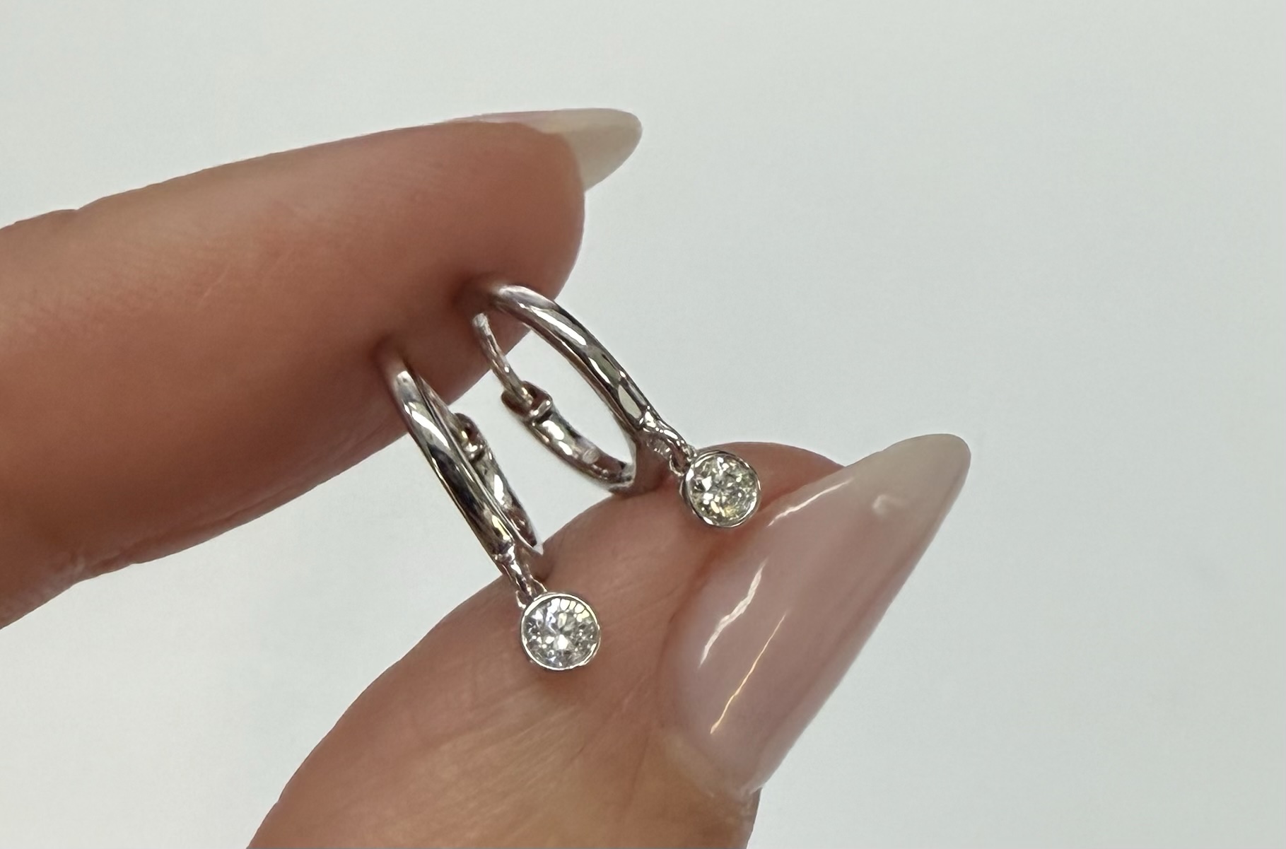 14k White Gold Genuine .08 Cttw Diamond Bezel Dangle Huggy Hoop Earrings - Image 3