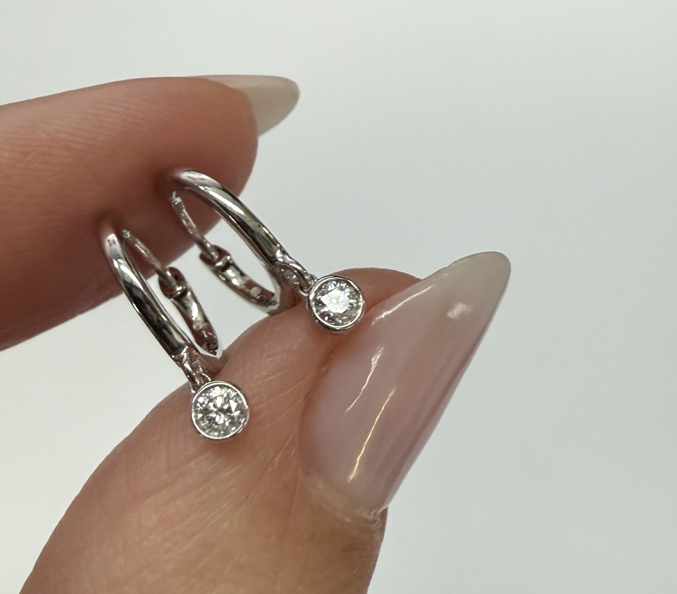 14k White Gold Genuine .08 Cttw Diamond Bezel Dangle Huggy Hoop Earrings - Image 4