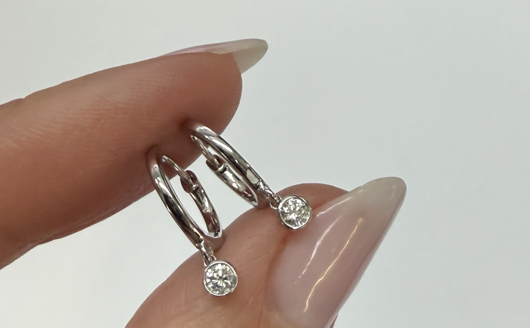 14k White Gold Genuine .08 Cttw Diamond Bezel Dangle Huggy Hoop Earrings - Image 5