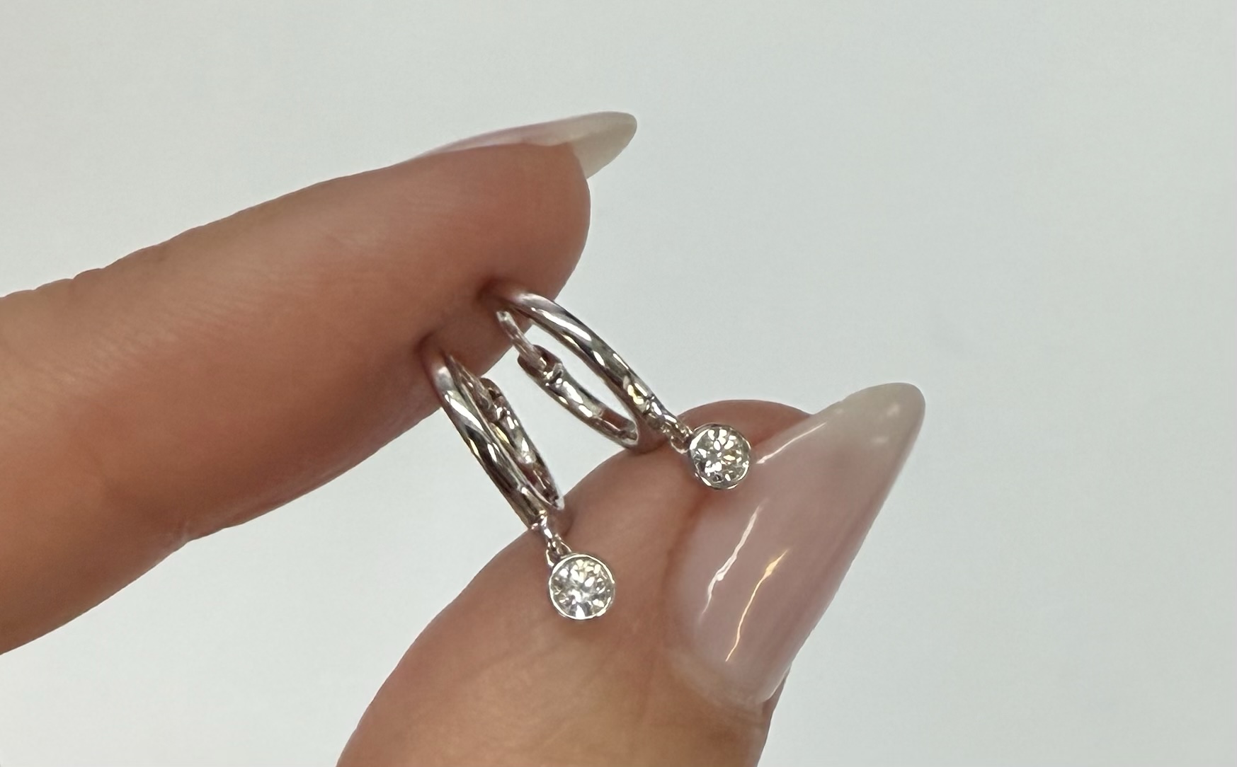 14k White Gold Genuine .08 Cttw Diamond Bezel Dangle Huggy Hoop Earrings - Image 6