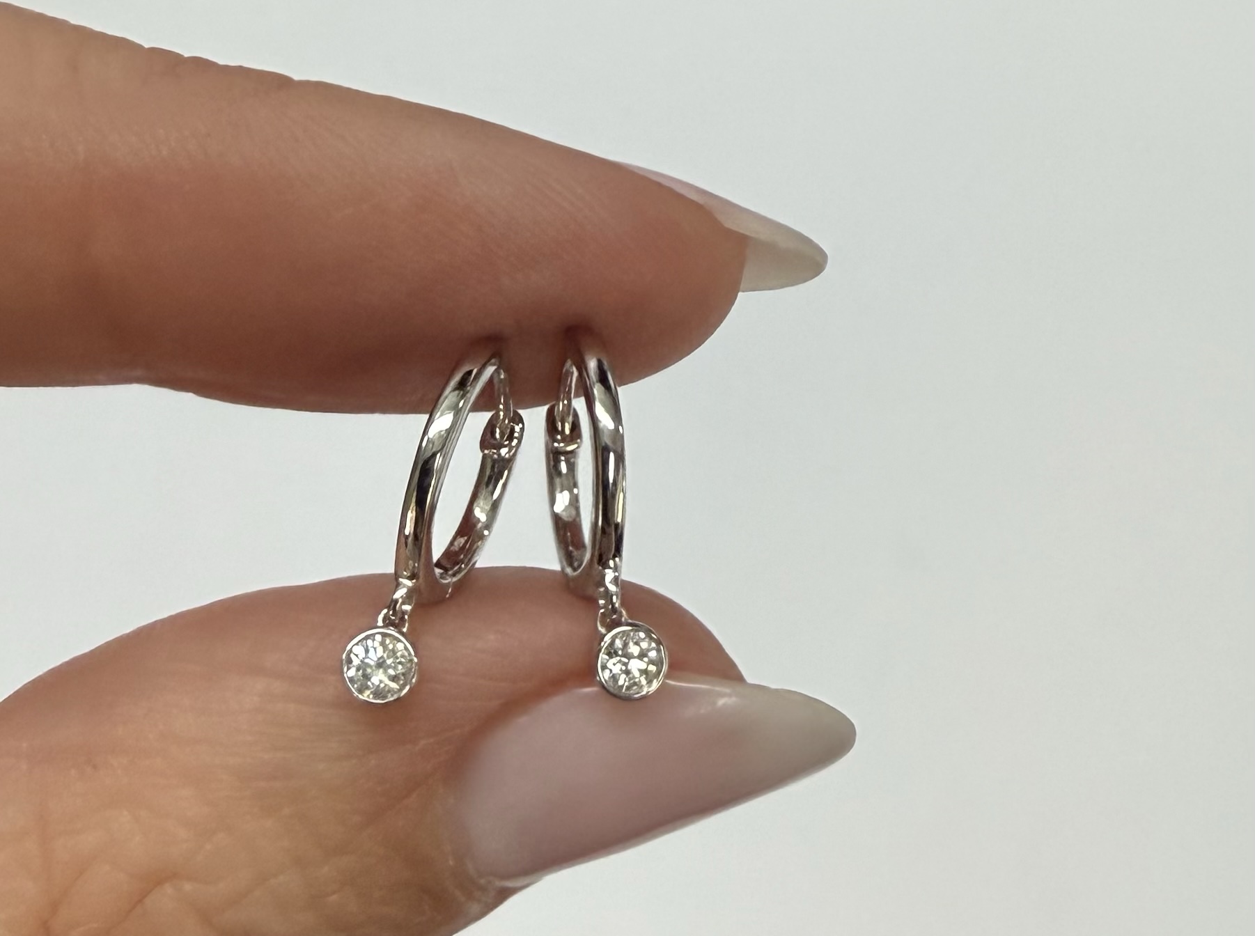 14k White Gold Genuine .08 Cttw Diamond Bezel Dangle Huggy Hoop Earrings - Image 9