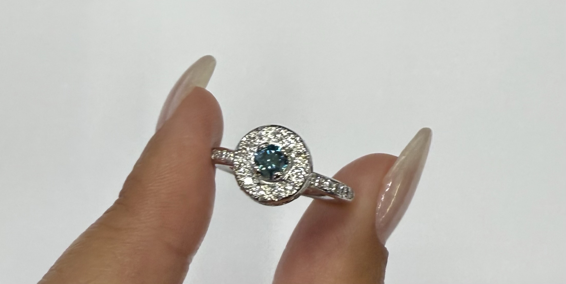 14k White Gold Genuine .24 Cttw Blue Diamond & .35 Cttw Round Brilliant Cut Diamond Halo Ring