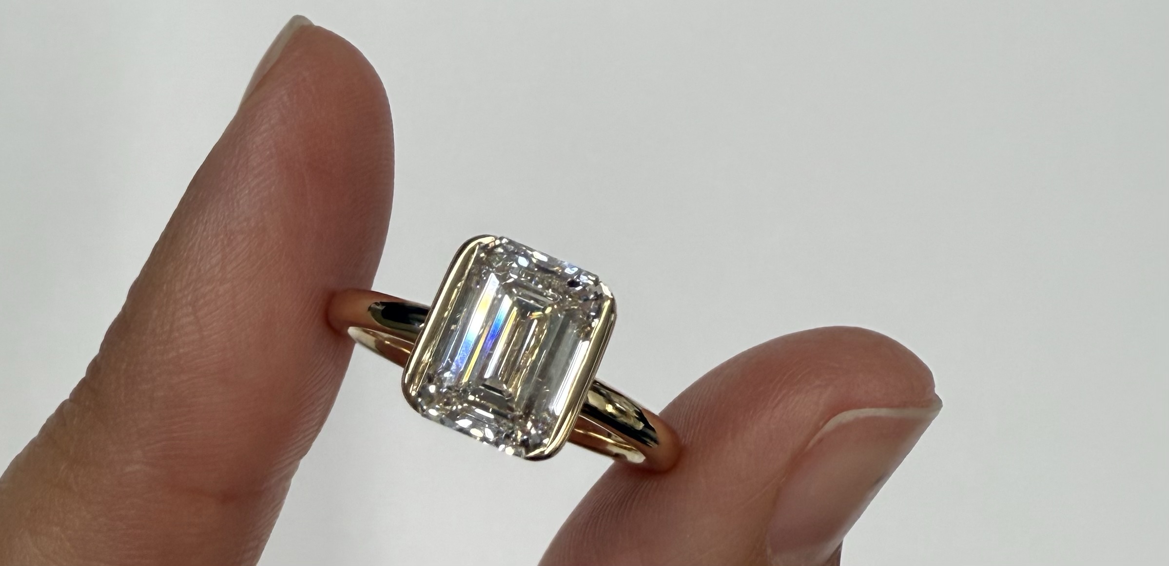 14k Yellow Gold Genuine IGI Certified Laboratory Grown 2.41 Carat Emerald Cut Diamond Partial Bezel Ring - Image 2